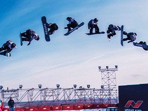 Glacier looms over the water as water falls from it